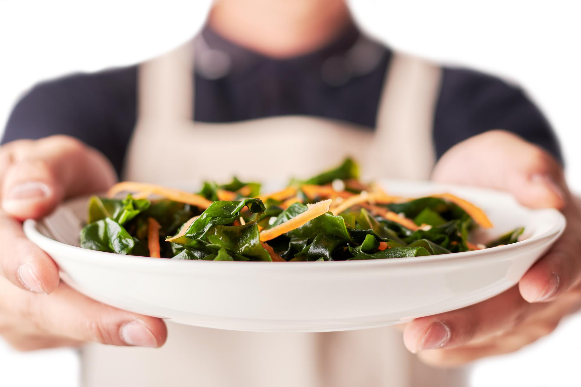 Chef preparing a fast healthy meal in small kitchen